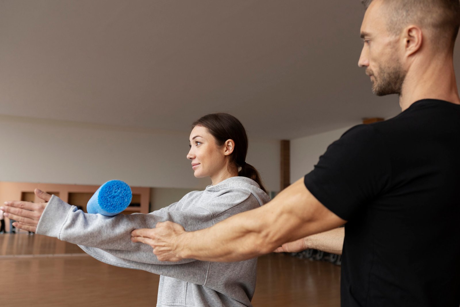 patient-doing-physical-rehabilitation-helped-by-therapists (1)